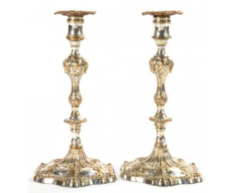A PAIR OF SHEFFIELD PLATE CANDLESTICKS BY WINTER & CO, C1770 with six shell foot and silvered copper nozzles, 27cm h Silvered