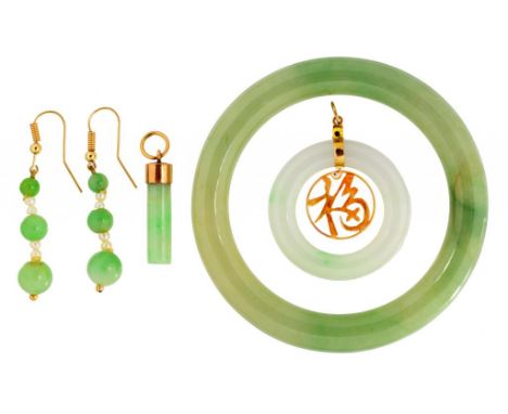 A SOUTH EAST ASIAN GOLD AND JADE PENDANT  3.3cm diam, marked 18k, a gold mounted jade baton pendant, a jade  bangle and a pai