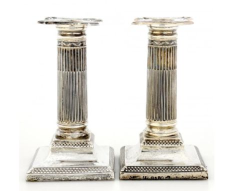 A PAIR OF VICTORIAN SILVER DWARF COLUMNAR CANDLESTICKS  with nozzles, 15cm h, by Henry Wilkinson & Co Ltd, London 1879, loade