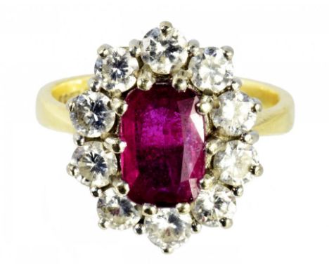 A RUBY AND DIAMOND OVAL CLUSTER RING  in 18ct gold, London hallmarked, 5.2g, size G ++In fine condition
