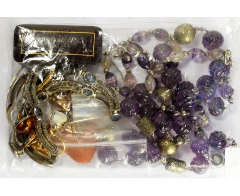 A NECKLACE OF SILVER AND CARVED AMETHYST BEADS, a necklace of fluorspar beads, an amber pendant, a marcasite and blue paste c