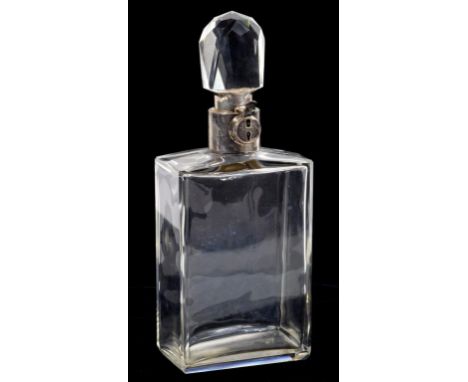 A GEORGE V SILVER MOUNTED GLASS SPIRIT DECANTER AND STOPPER with lock, 31cm h, by Mappin & Webb Ltd, Birmingham 1929 ++Sold w