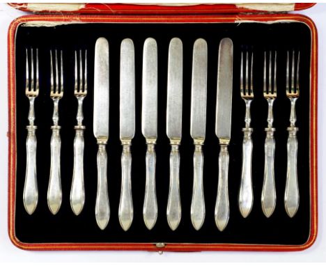 A SET OF SIX GEORGE V SILVER HAFTED DESSERT KNIVES AND FORKS  by R R Mosley & Co Ltd, Sheffield 1915, cased ++In good conditi