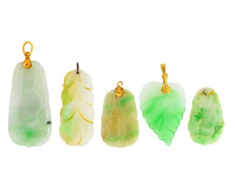 FIVE SOUTH EAST ASIAN CARVED JADE AND JADEITE PENDANTS  three gold mounted, 3-5cm  ++As a lot in fine condition 