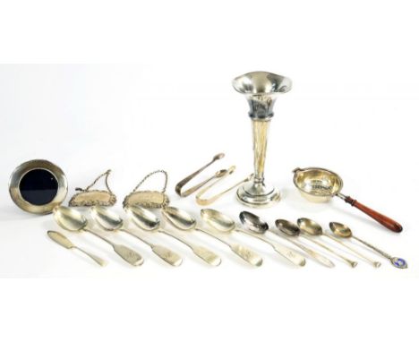 MISCELLANEOUS SILVER FLATWARE, A WOOD HANDLED TEA STRAINER, VASE, PAIR OF DECANTER LABELS AND CIRCULAR PHOTOGRAPH FRAME,  GEO