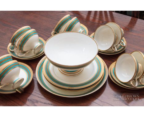 A Royal Worcester part tea service, 7970 pattern, banded in jewelled turquoise and gilt, Empire form cups,  comprising eight 