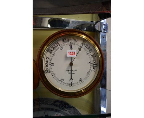 An early 20th century oak aneroid barometer, by Benetfink &amp; Co, 24.5cm diameter. 