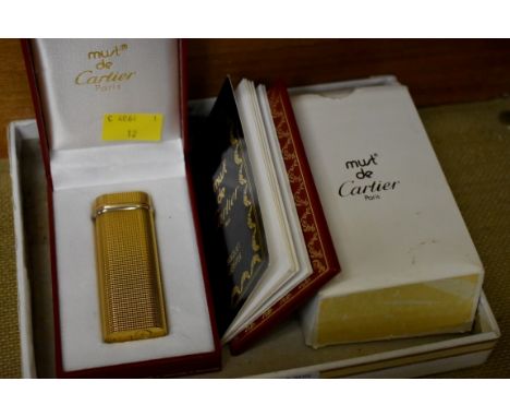 A Must de Cartier gilt lighter,&nbsp;with box and paperwork.&nbsp; 