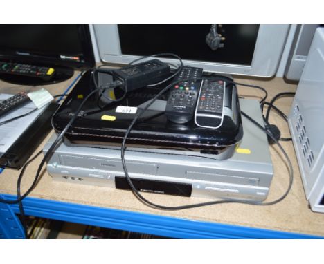 A Toshiba DVD player and video cassette recorder; together with a Humax freesat box with remote control
