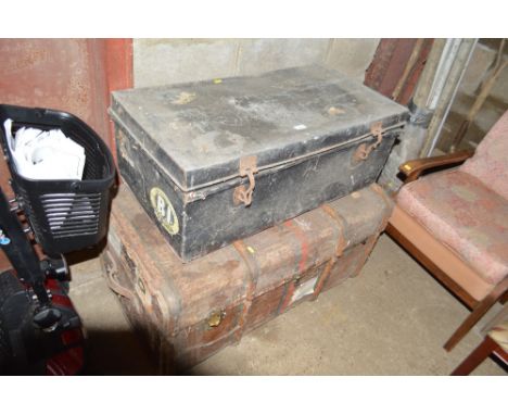 A travelling trunk and another metal trunk