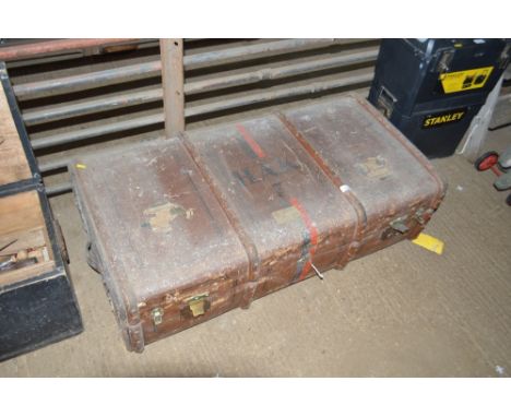 A wooden and metal bound travelling trunk