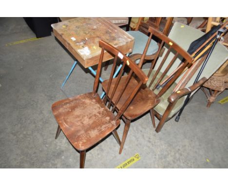 A pair of Ercol stick back dining chairs