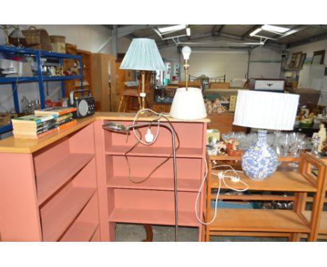 Two brass table lamps; a floor standing adjustable reading lamp 