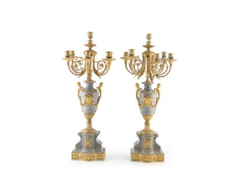 A PAIR OF LOUIS SEIZE STYLE ORMOLU MOUNTED AND GREY VEINED MARBLE CANDLEABRA, the six light sconces raised above an urn shape