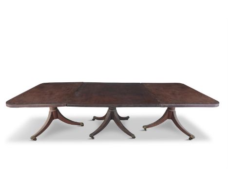 AN IMPORTANT IRISH GEORGE III MAHOGANY DINING TABLE, the top some 2'' thick, with reeded rim, raised on three pods, each with