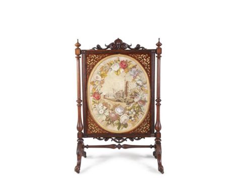 A VICTORIAN WALNUT AND SIMULATED ROSEWOOD FRAMED FIRE SCREEN, of generous proportions, the rectangular frame surmounted with 
