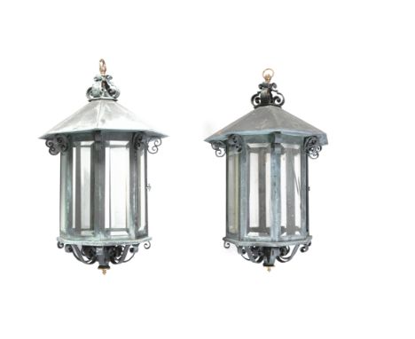 A PAIR OF LARGE BRONZE OCTAGONAL LANTERNS IN THE GEORGIAN STYLE, each with domed top and scrollwork cresting, fitted with eig
