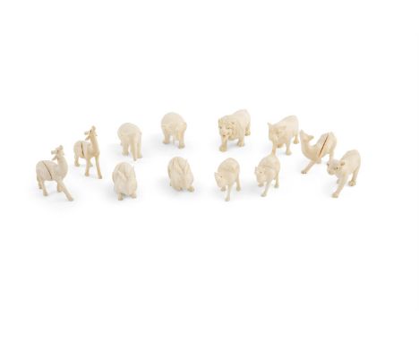 A COLLECTION OF TWELVE INDIAN MINIATURE CARVED IVORY ANIMALS, comprising elephants, lions, camels and others, to be used as p