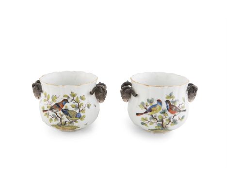 A PAIR OF PORCELAIN POTS, of compact baluster form, the white panelled bodies with polychrome decoration of birds and foliage