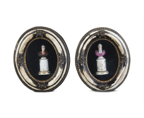 A PAIR OF STAFFORDSHIRE POLYCHROME PORTRAIT BUSTS ON PEDESTALS, depicting George III and George IV, contained within deep ova
