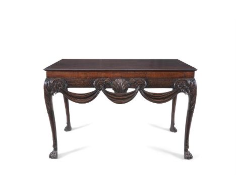 A FINE IRISH GEORGE II MAHOGANY RECTANGULAR SIDE TABLE, c.1750, the top with moulded rim above a frieze centred by a carved s