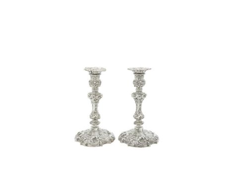 A PAIR OF VICTORIAN ROCOCO REVIAL SILVER CANDLESTICKS AND SCONCES, London 1895, mark of Henry Wilkinson &amp; Co, each lavish