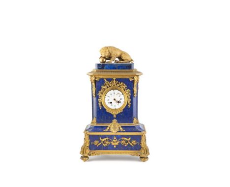 A LOUIS XV ORMOLU AND LAPIS LAZULI CASED MANTLE CLOCK, of upright rectangular form, surmounted with a crouching lion guarding