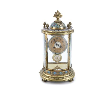 A FRENCH BRASS AND CHAMPLEVE ENAMEL MOUNTED MANTLE CLOCK, the bowed glazed case of bowfront design, surmounted with leafy fin