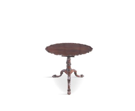 AN IRISH GEORGE III MAHOGANY CIRCULAR DISHED TOP TABLE, with moulded rim, above a birdcage atop a carved column support with 