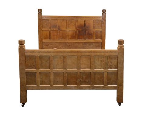 Robert 'Mouseman' Thompson of Kilburn, an oak panelled double bed, dated 1941, the head and foot boards with halfpenny mouldi