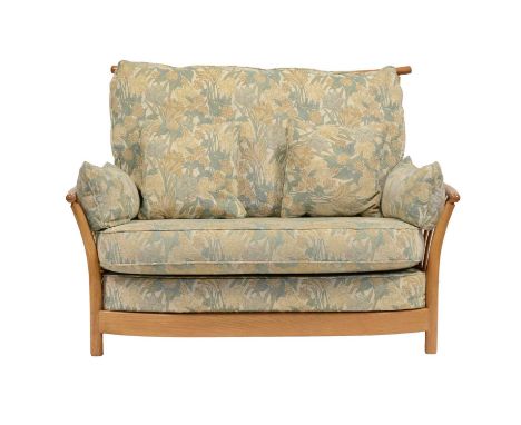 Ercol, a 'Renaissance' five-piece lounge suite, comprising three armchairs; a two-seat sofa; and a footstool, all with matchi