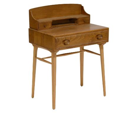 Ercol 479 writing table, elm and beech, raised back with a shelf and two small drawers, single frieze drawer, width 69cm, dep