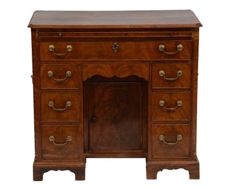 George III mahogany dressing table, canted corners, fitted with a brushing slide over a single frieze drawer, shaped kneehole