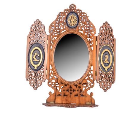 Victorian olive wood folding travelling mirror, fretted frame with easel back, central oval glass surrounded by initials CLM(