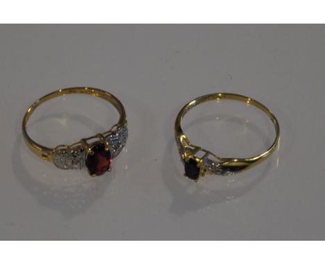 A garnet and diamond dress ring together with a sapphire and diamond ring, both claw set in 9ct yellow gold bands