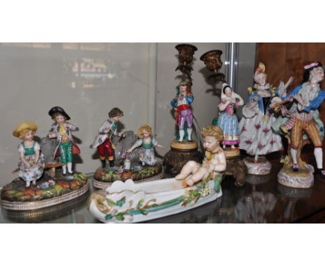 A  collection of seven early 20th Century and later German ceramic figures and groups to include  a pair of gilt metal mounte