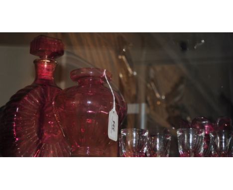 A ruby glass decanter together with 6 shot glasses, a dish and two vases