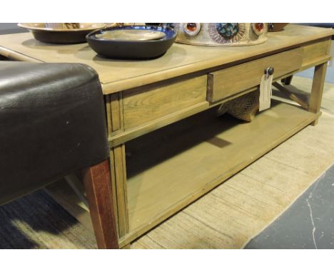 A modern light oak two tier coffee table with fitted drawer, w:115cm