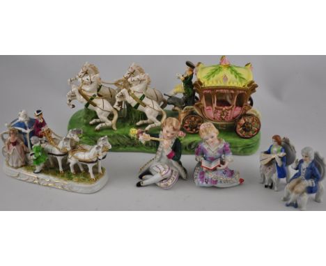 A Continental glazed ceramic coach and horses, together with another similar smaller, and 2 pairs of figures 