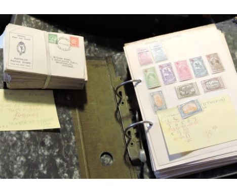 A suitcase of world and Commonwealth stamps, Victoria to George VI. Several albums plus covers including older First Day. Als