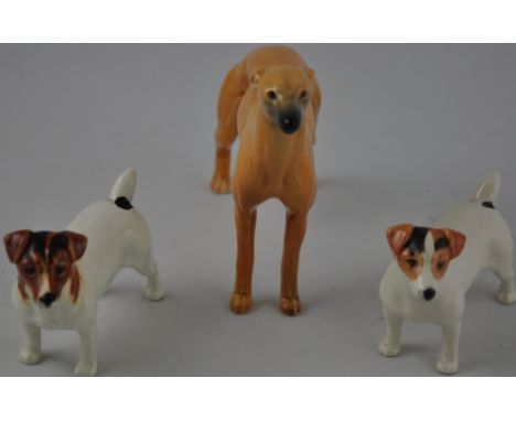 A pair of Beswick ceramic Jack Russell figures H. 7cm, together with a Beswick figure of a whippet (3)