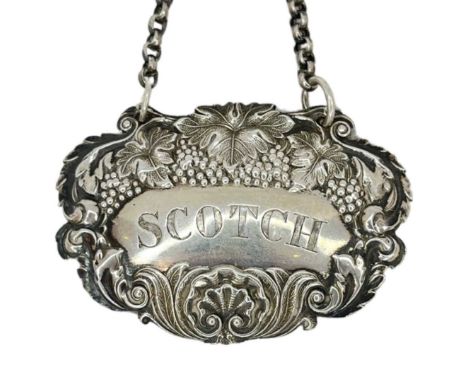 Silver Wine Label - 'Scotch'. 17 g. London 1898, Hollard and Slater, With typical naturalistic decorationWidth 6 cmsCondition