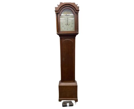 An early 19th century oak cased 8-day long case clock.The arched hood with freestanding columns to a moulded throat and long,