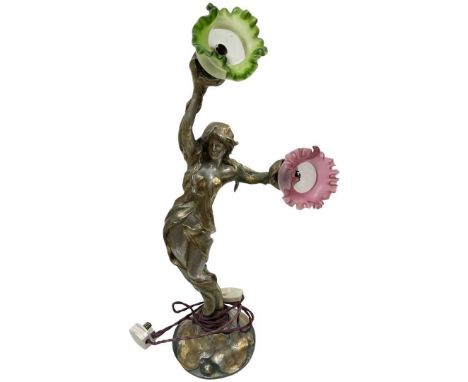 An Art Nouveau Spelter Painted Figure Lamp Circa 1910,signed indistinctly, with original glass shades.