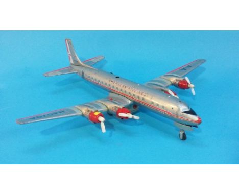 A Japanese tin plate model plane, a boxed Clifford Toys Vauxhall Vega Coach and a tin plate remote control tank