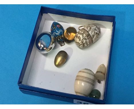 A collection of various eggs including Ivory, mother of pearl etc.