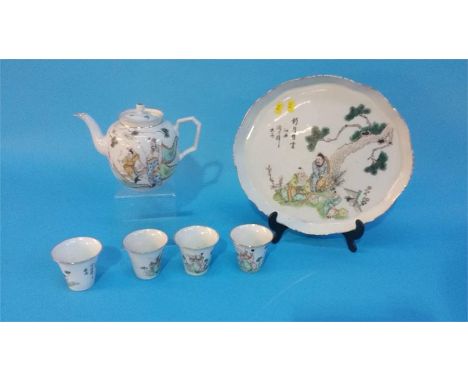 A Chinese tea set comprising tea tray, four tea bowls and a teapot