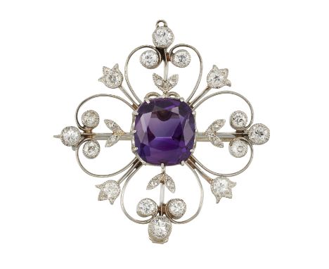 AN AMETHYST AND DIAMOND BROOCH/PENDANT, the cushion cut amethyst, estimated approx. 3.75cts, claw mounted in scrolled framewo