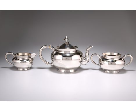 A CHINESE SILVER THREE PIECE TEA SERVICE, by Wang Hing &amp; Co, late 19th/early 20th century, the squat formed teapot with c