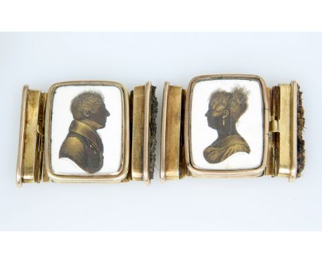 A PAIR OF 19TH CENTURY PORTRAIT MINIATURE BRACELET CLASPS BY JOHN FIELD, the clasps of a lady and gentleman, painted in black